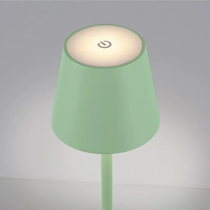 Just Light Lámpara de sobremesa a batería Euria - 3 W, L x An x Al: 11 x 11 x 37 cm, Blanco cálido, Verde - Primer plano de una lámpara táctil verde menta con una pantalla redonda e iluminada y un discreto símbolo de encendido/apagado para una iluminación suave.