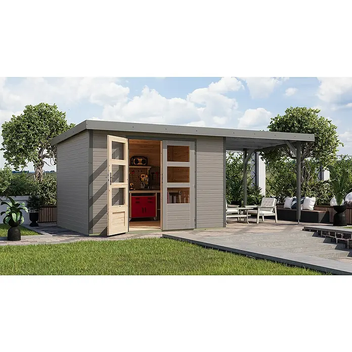 Karibu Gartenhaus Jupiter 5 D - Außenmaß inkl. Dachüberstand (B x T): 541,5 x 266,5 cm, Holz, Wassergrau/Grau, Mit Seitendach - Ein modernes Gartenhaus mit offenen Türen, das Einblick in eine Werkstatt bietet, ergänzt durch eine stilvolle Terrassenüberdachung für den Außenbereich.
