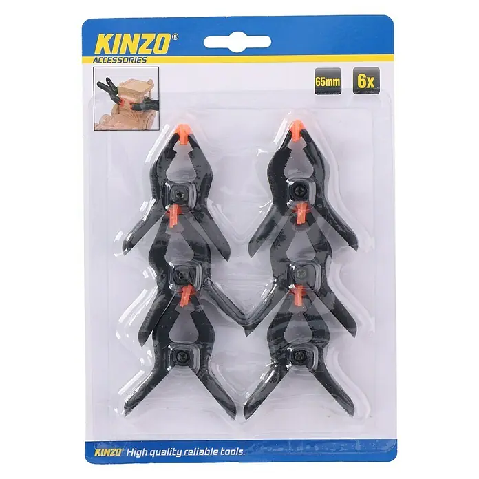 Pinza con resorte - Apertura máxima: 30 mm, 6 ud. - Imagen de un paquete de seis pinzas de resorte de 65 mm de Kinzo, ideales para sujetar piezas de trabajo al realizar manualidades.