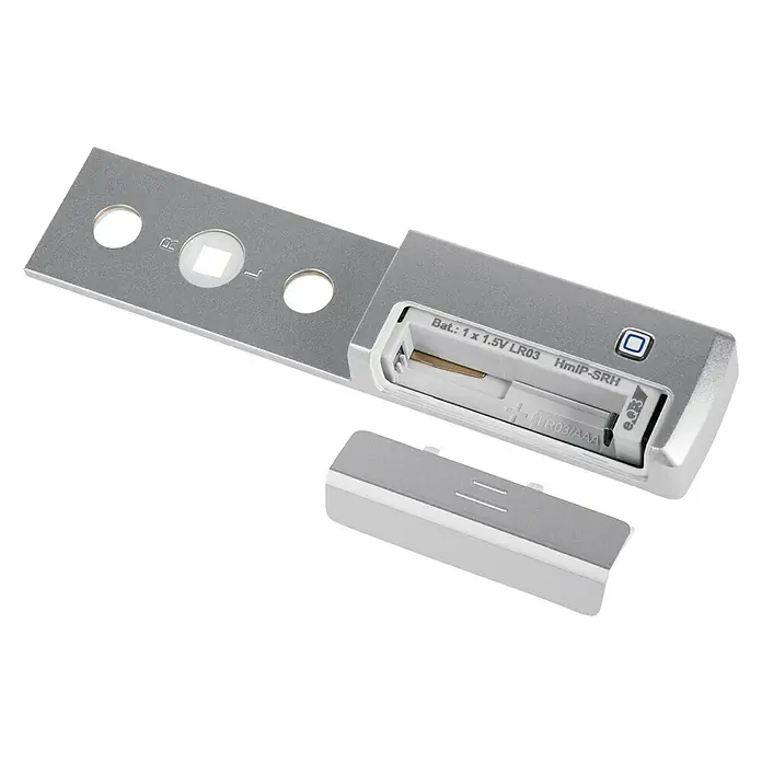 Homematic IP Fenstersensor HmIP-SRH - Weiß, 16 x 32 x 143 mm, Batteriebetrieben - Silbernes elektronisches Gerät mit offenem Batteriefach, das eine LR03/AAA-Batterie aufnimmt, mit abgenommener Abdeckung.