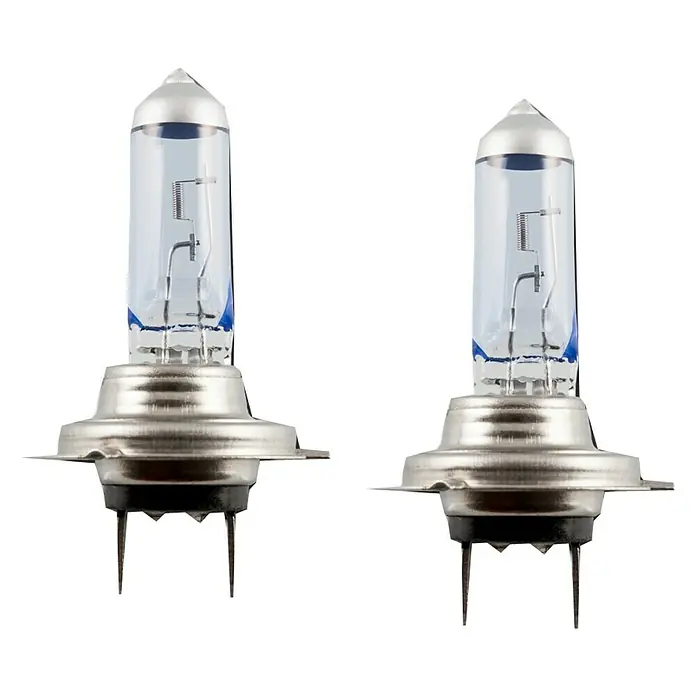 Bombilla para faro delantero BOM12722 - 12 V, 2 ud., Azul - Primer plano de dos bombillas halógenas H7 con vidrio transparente y base metálica sobre fondo negro.