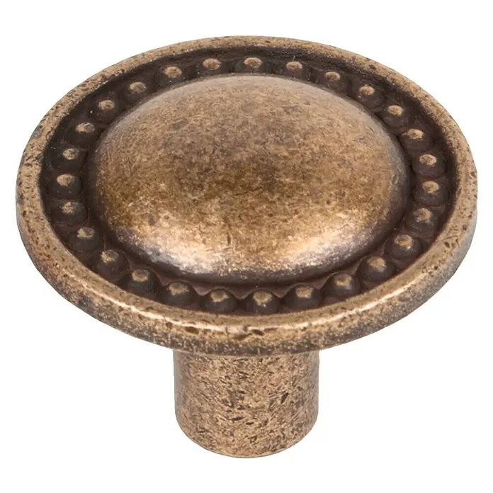 Nesu Pomo para muebles 387BR - Tipo de tirador del mueble: Botón, Ø x Al: 25 x 20 mm, Acero - Primer plano de un tirador de bronce para muebles con detalles circulares, ideal para renovaciones.
