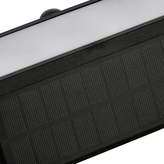 Lavida Solar-Außenwandleuchte - 5 W, L x B x H: 25 x 12 x 6,5 cm, Schwarz, IP54, 500 lm - Detailaufnahme einer Solarlampe mit einem weißen Lichtband und einem schwarzen Solarpaneel für den Außenbereich.