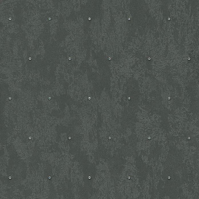Glööckler Pompöös Provence Vliestapete Glitzersteinchen - Schwarz, Metalloptik, 10,05 x 0,53 m - Nahaufnahme einer grauen Betonmauer mit einer regelmäßigen Anordnung von eingelassenen Schrauben für einen industriellen Look.
