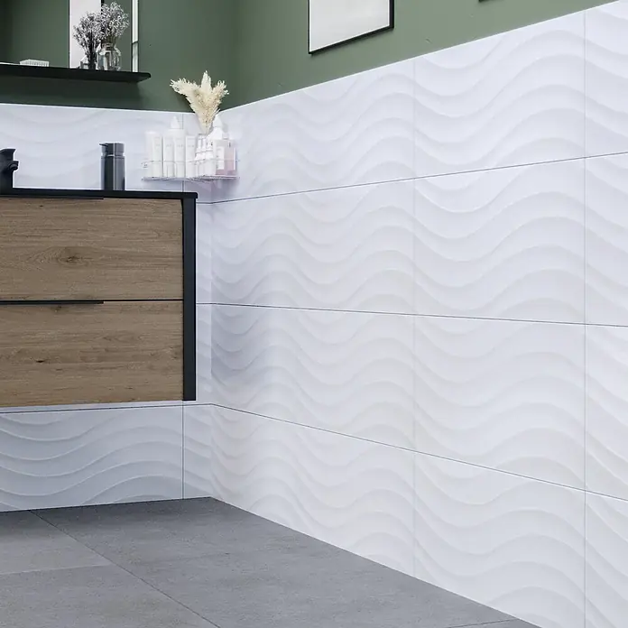 Ambiente by Palazzo Wandfliese Snowwhite Wave30 x 60 cm, Stärke: 9 mm, Weiß, Glänzend - Wandverkleidung mit eleganten, weißen 3D-Wellenziegeln, die ein modernes und stilvolles Badezimmerambiente schaffen.
