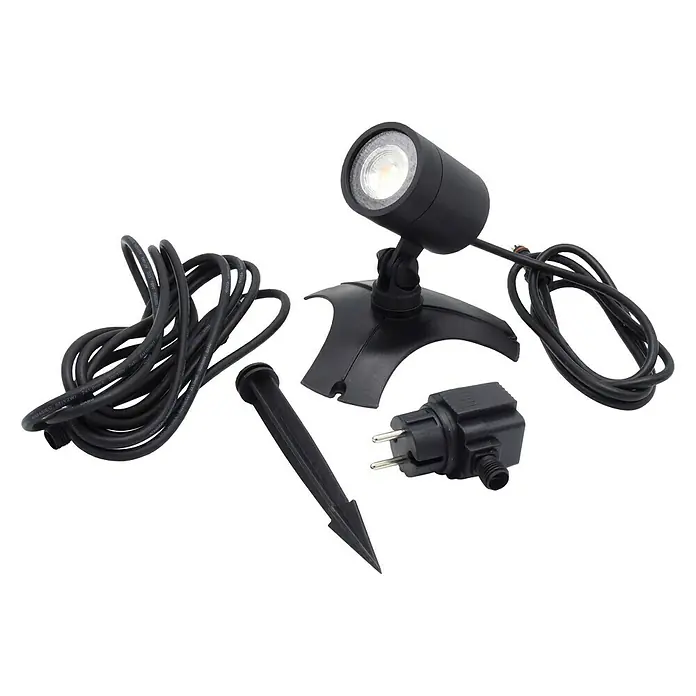 Ubbink Unterwasserspot - Geeignet für: Unterwasserbereich - Das Bild zeigt einen schwarzen LED-Gartenstrahler mit Zubehör, inklusive Erdspieß und Stecker, vor einem dunklen Hintergrund.