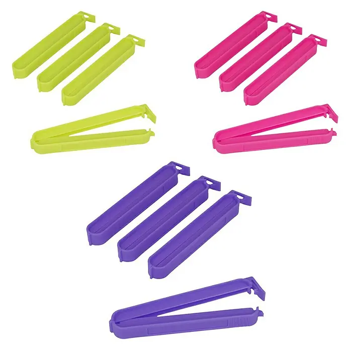 Metaltex Clips - 4 Stk., L x B x H: 11 x 1,2 x 1,5 cm - Nahaufnahme von gelben, pinken und lilafarbenen Chip-Clips zum Verschließen von Lebensmittelverpackungen.