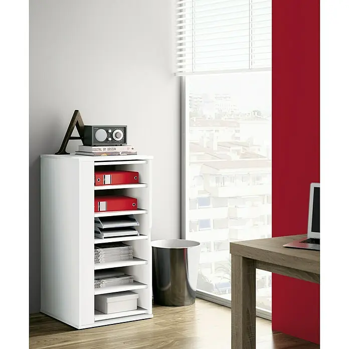 Muebles Pitarch Zapatero Naia - L x An x Al: 47 x 47 x 90 cm, Blanco - Una estantería blanca está al lado de una ventana y está llena de archivos, papeles y una pequeña caja. Hay objetos decorativos en la estantería.