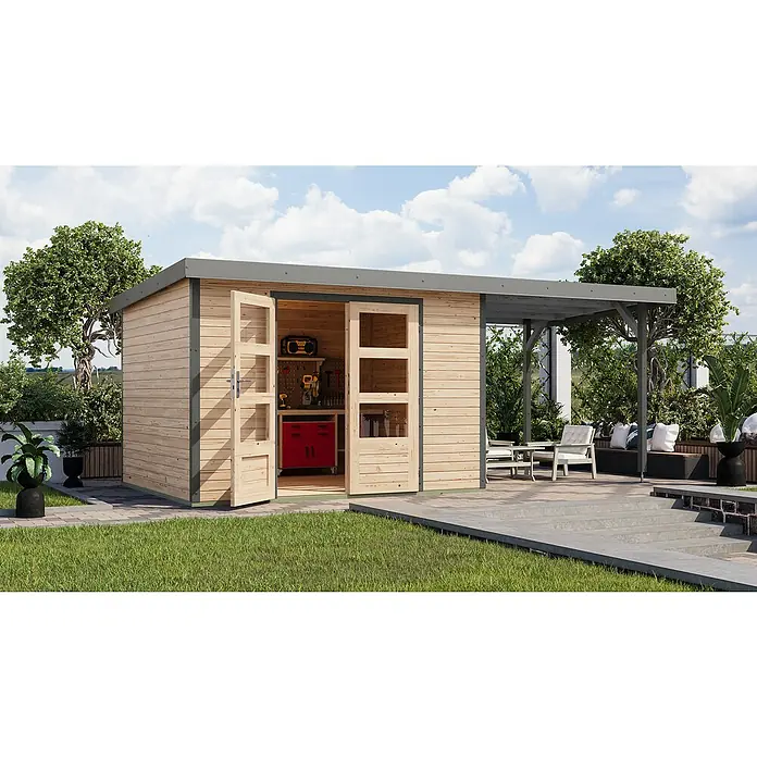 Karibu Gartenhaus Jupiter 5 A - Außenmaß inkl. Dachüberstand (B x T): 541,5 x 266,5 cm, Holz, Naturbelassen/Grau, Mit Seitendach - Holzgartenhaus mit offenem Eingang und Werkbank im Inneren, umgeben von Grün. Die Terrasse bietet einen schönen Sitzbereich im Freien.