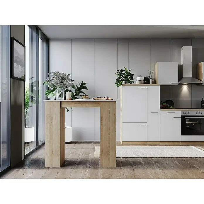Respekta Merle Bartisch - L x B x H: 67 x 138 x 108 cm, Weiß Matt - Küchenaufnahme mit einem hellen Holztisch mit weißen Akzenten, Pflanzen und einer modernen Küchenzeile.