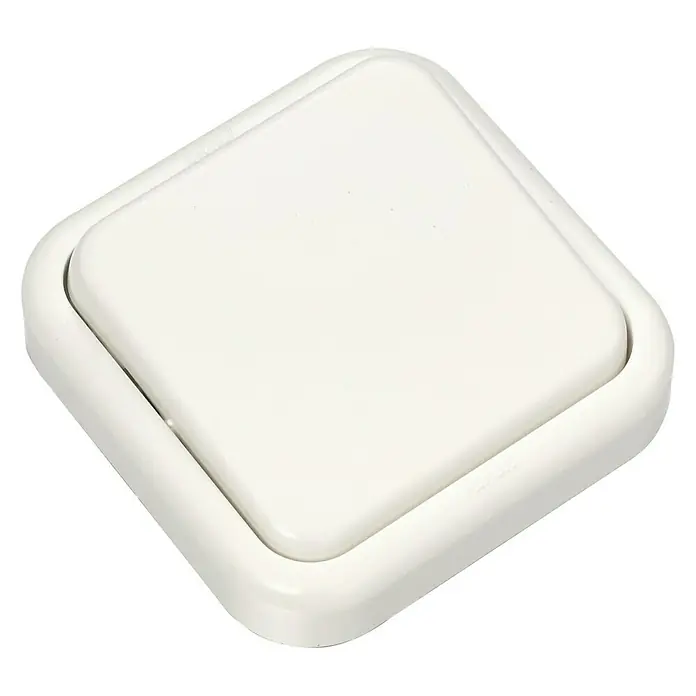 Fontini Kristal Cruzamiento - Blanco, Montaje en superficie - Primer plano de un interruptor de luz cuadrado color crema con bordes redondeados montado sobre una superficie negra.