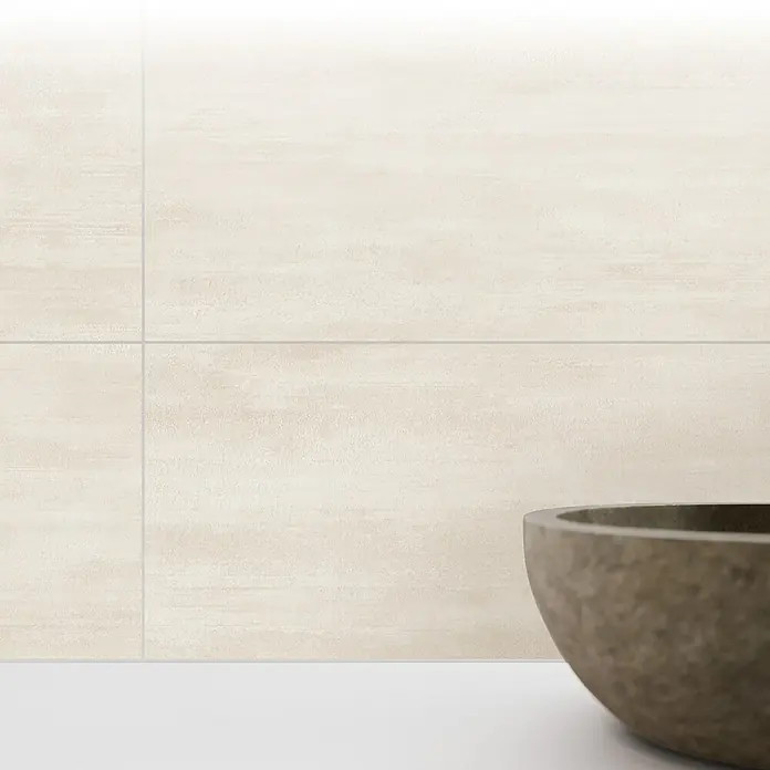 Wandfliese Miami Beach New - 30 x 60 cm, Beige, Matt - Nahaufnahme einer stilvollen Steinschale vor beigen Fliesen, ideal für Badezimmer- oder Küchendesign. Elegante und moderne Ästhetik.