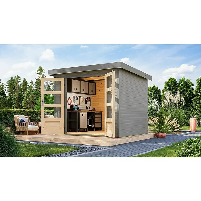 Karibu Gartenhaus Jupiter 3 D - Außenmaß inkl. Dachüberstand (B x T): 266 x 236,5 cm, Holz, Wassergrau/Grau - Die Abbildung zeigt ein Gartenhaus mit Werkbank, Schränken und Werkzeugen. Das Haus hat offene Holztüren und eine graue Aussenverkleidung.