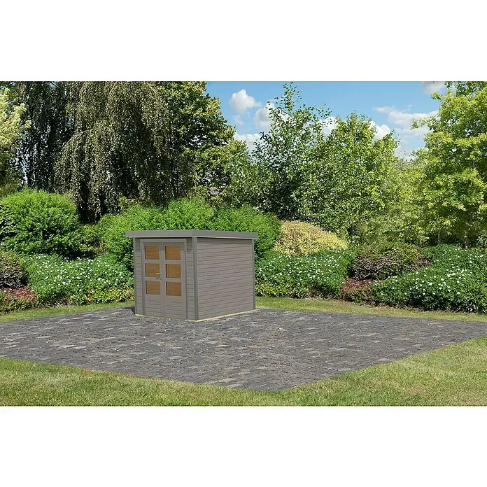 Karibu Gartenhaus Jupiter 2 D - Außenmaß inkl. Dachüberstand (B x T): 228,5 x 235 cm, Holz, Wassergrau/Grau - Abbildung eines Gartenhauses mit Holzverkleidung und Doppeltür aus Glas auf einer gepflasterten Fläche, umgeben von üppigem Grün.
