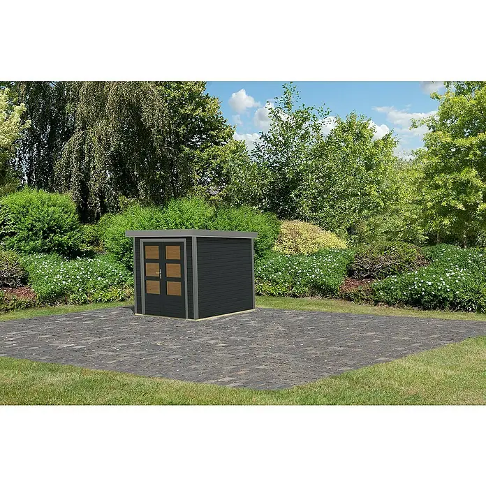 Karibu Gartenhaus Jupiter 2 C - Außenmaß inkl. Dachüberstand (B x T): 228,5 x 235 cm, Holz, Anthrazit/Grau - Ein kompaktes, dunkelgraues Gartenhaus mit Doppeltür steht auf einer gepflasterten Fläche, umgeben von üppigem Grün.