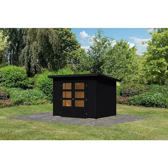Karibu Gartenhaus Stockach 3 - Außenmaß inkl. Dachüberstand (B x T): 282 x 210 cm, Holz, Schwarz - Schwarzes Gartenhaus mit Doppeltür und Fenster auf gepflasterter Fläche, umgeben von Grün.