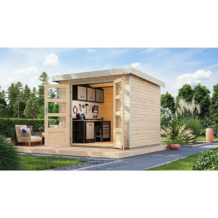 Karibu Gartenhaus Jupiter 3 A - Außenmaß inkl. Dachüberstand (B x T): 266 x 236,5 cm, Holz, Naturbelassen/Weiß - Ein modernes Holzgartenhaus mit Doppeltüren und Werkbank im Inneren, umgeben von Grün. Ideal für Hobbygärtner und Heimwerker.