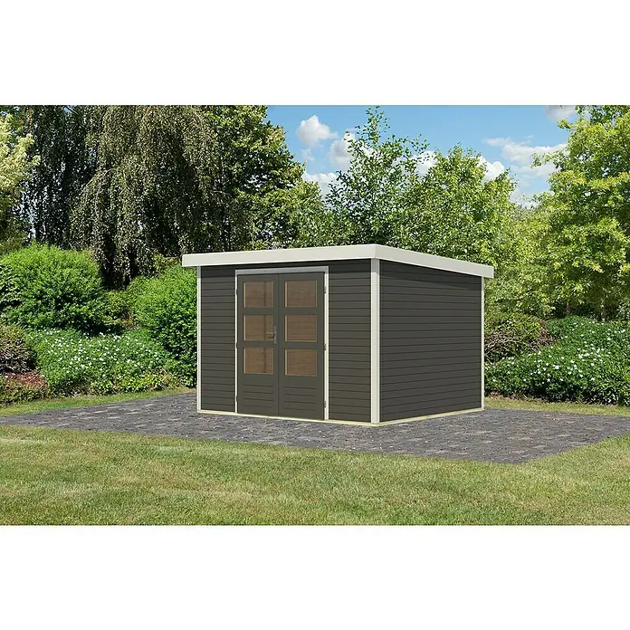 Karibu Gartenhaus Jupiter 5 B - Außenmaß inkl. Dachüberstand (B x T): 320,5 x 266,5 cm, Holz, Terragrau/Weiß - Ein graues Gartenhaus mit Doppeltür und weißem Rahmen, stehend auf einem gepflasterten Bereich, umgeben von Grün.