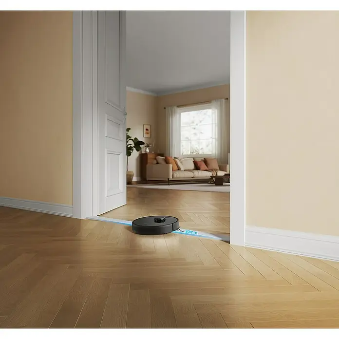 Dreame Robot aspirador con mopa D9 Max - Potencia de aspiración: 4.000 Pa, Duración de la batería: 150 min, Capacidad del robot: 570 ml - Un robot aspirador negro limpia un piso de madera en una habitación luminosa, navegando a través de una puerta marcada con líneas azules.
