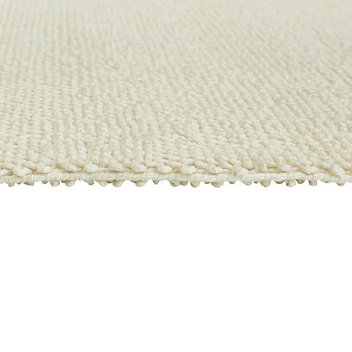 Badteppich Atlanta - 50 x 80 cm, Weiß, 100% Baumwolle - Detailaufnahme eines cremefarbenen Teppichs mit gewebter Textur, der Weichheit und Komfort für jeden Raum verspricht.
