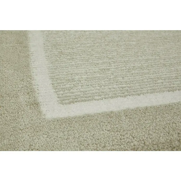 Badteppich Maui - 50 x 80 cm, Beige, 100% Polyester - Nahaufnahme eines Teppichs mit hellem Randdesign, das ein subtiles, aber elegantes Detail für die Bodengestaltung bietet. Die Textur des Teppichs lädt zum Berühren ein.