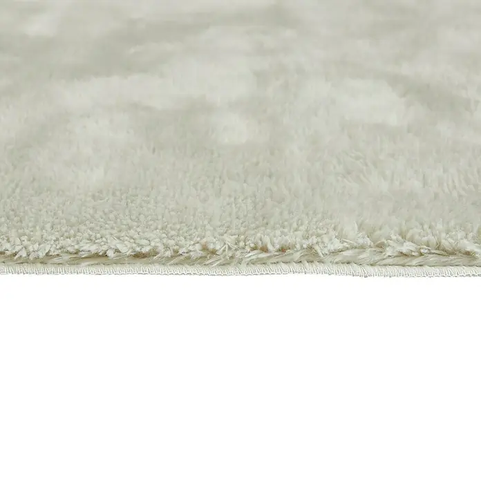 Badteppich Florida - 50 x 80 cm, Beige, 100% Polyester - Nahaufnahme eines weißen Teppichs mit weicher Textur, ideal für gemütliche Wohnräume.