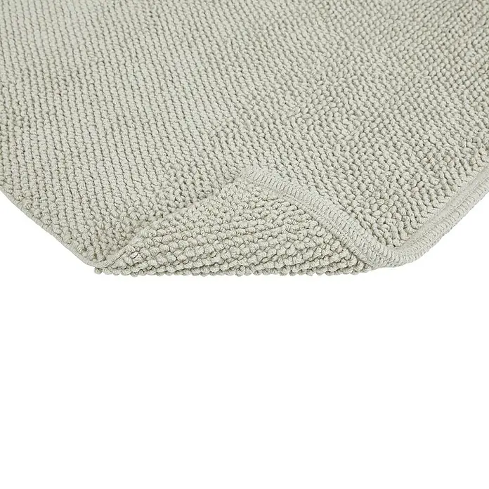 Badteppich Atlanta - 50 x 80 cm, Grau, 100% Baumwolle - Nahaufnahme einer grauen, strukturierten Badematte, die Weichheit und Komfort für den täglichen Gebrauch im Badezimmer verspricht.