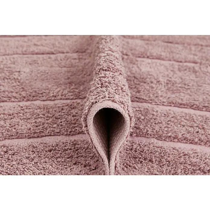 Badteppich Havanna - 50 x 80 cm, Rostrot, Border, 80% Baumwolle, 20% Polyester - Nahaufnahme eines gefalteten, rosafarbenen Handtuchs mit Textur.