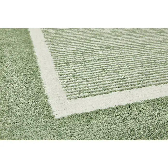 Badteppich Maui - 60 x 100 cm, Salbei, 100% Polyester - Nahaufnahme eines Teppichs mit grünem Flor und weißem Bordürenmuster.