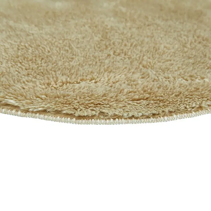Badteppich Florida - 60 x 60 cm, Taupe, 100% Polyester - Nahaufnahme eines runden, beigefarbenen Teppichs mit flauschiger Textur und gewebtem Rand, der Komfort und Stil vermittelt.