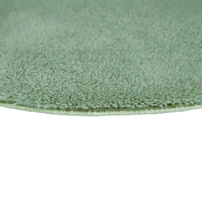Badteppich Florida - 60 x 60 cm, Salbei, 100% Polyester - Detailaufnahme eines runden, hellgrünen Teppichs mit weicher Textur, ideal für ein gemütliches Zuhause.