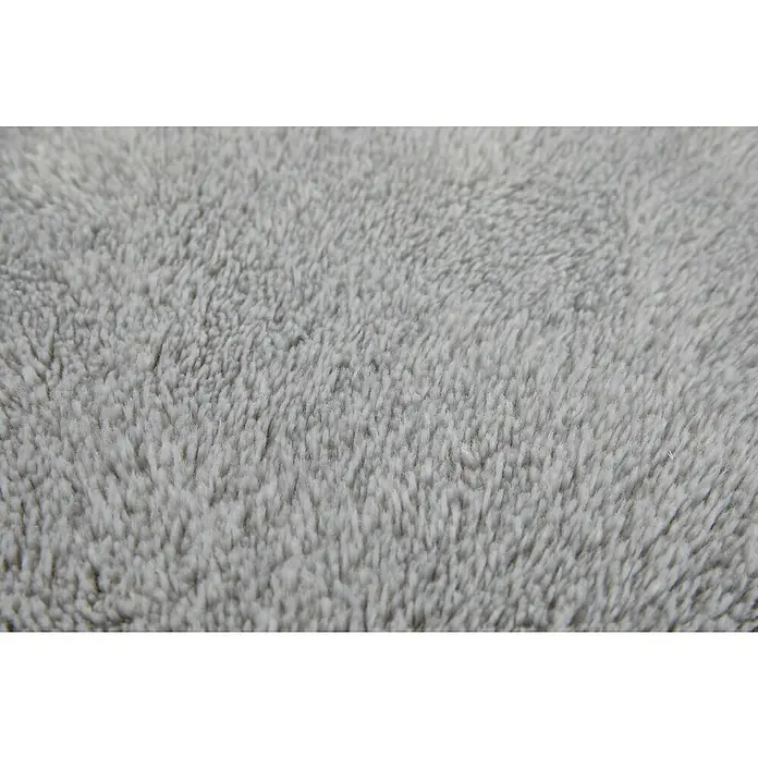 Badteppich Florida - 60 x 100 cm, Grau, 100% Polyester - Nahaufnahme eines flauschigen, grauen Textilstoffs, der eine weiche und einladende Textur zeigt. Ideal für gemütliche Decken oder Kissen.
