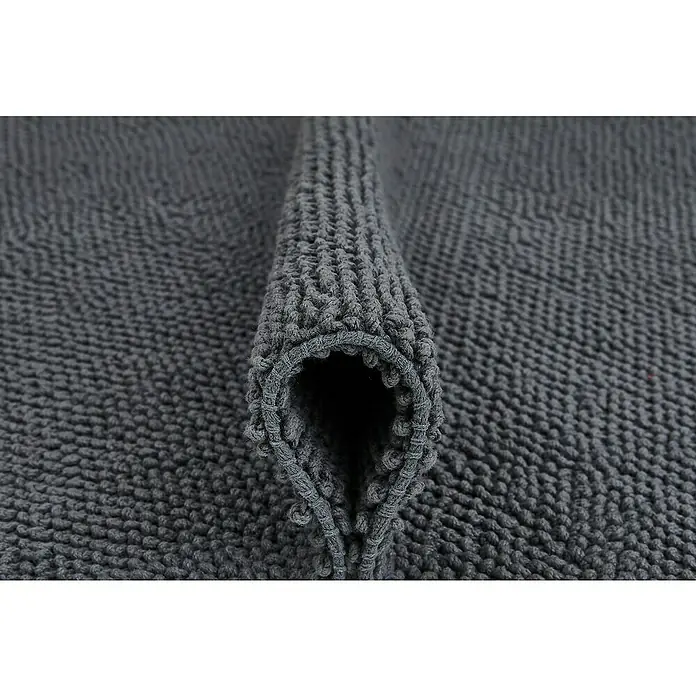 Badteppich Atlanta - 50 x 80 cm, Anthrazit, 100% Baumwolle - Nahaufnahme eines gerollten, grauen Chenille-Badezimmers Teppichs, der weich und saugfähig ist. Ideal für Badezimmer.