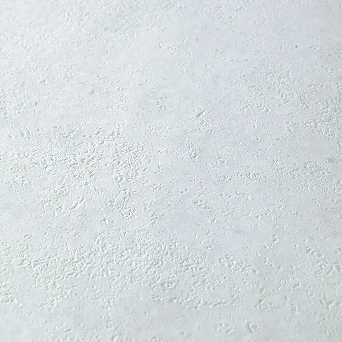 Grosfillex Wall+ Wandpaneel - White Stone, 1.200 x 600 x 5 mm - Detailaufnahme einer weißen, strukturierten Oberfläche, die eine subtile, taktile Qualität des Produkts hervorhebt.
