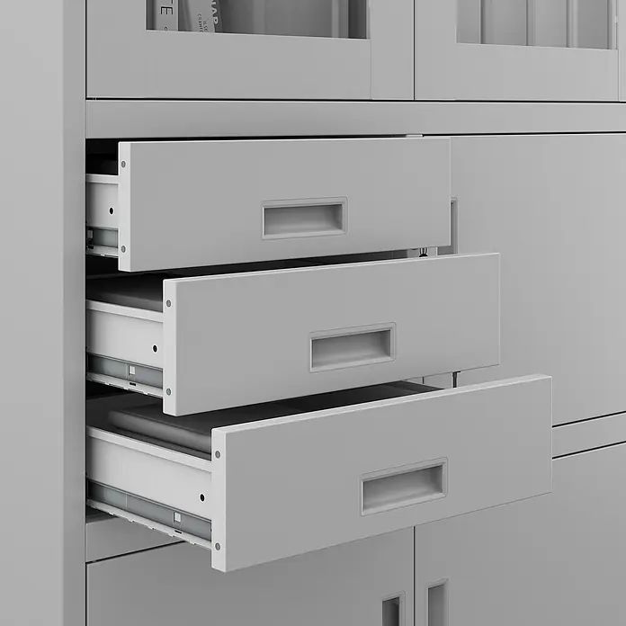 Jan Nowak Aktenschrank Filip - B x T x H: 90 x 40 x 185 cm, Grau - Nahaufnahme eines Schranks mit drei teilweise geöffneten Schubladen, die das schlichte und funktionale Design des Möbelstücks hervorheben.