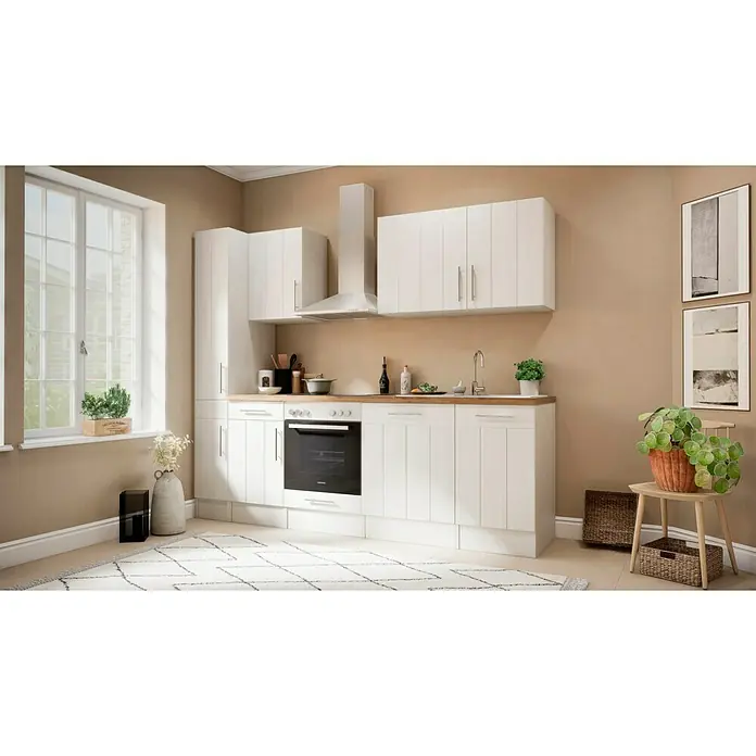 Respekta Premium Küchenzeile Anton - Breite: 250 cm, Weiß, Mit Elektrogeräten - Helles Küchendesign mit weißen Schränken, Holzplatte und modernen Geräten, beleuchtet durch ein großes Fenster.