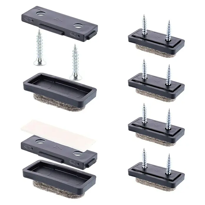 Wagner System Möbelgleiter-Set - L x B x H: 32 x 18 x 18 mm, Grau, 4 Stk. - Das Bild zeigt eine Nahaufnahme von Möbelgleitern mit Schrauben. Diese Gleiter sind ideal zum Schutz von Böden vor Kratzern durch Möbel.