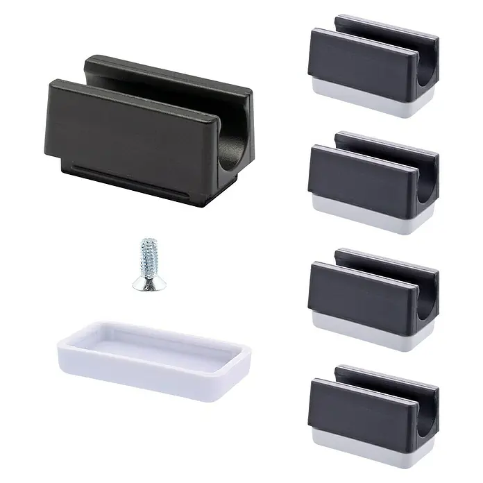 Wagner System Möbelgleiter-Set - L x B: 32 x 18 mm, Lochdurchmesser: 11 mm, Rechteck, 4 Stk. - Produktbild von schwarzen Kabelklemmen mit weißem Sockel und einer Schraube, geeignet für die Kabelorganisation.