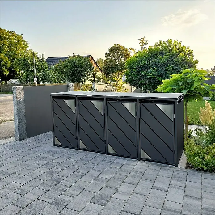 Metzler Mülltonnenbox - Stahl, Anthrazit, Geeignet für Anzahl Mülltonnen: 4 Stk. - Bild eines Mülltonnenbox-Systems im Außenbereich mit vier Fächern, diagonalem Design und silbernen Akzenten auf einem gepflasterten Untergrund.