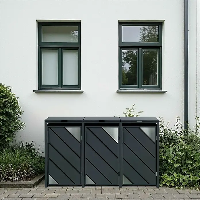 Metzler Mülltonnenbox - 198,5 x 80 cm, Stahl, Anthrazit, Geeignet für Anzahl Mülltonnen: 3 Stk. - Ein modernes Mülltonnenverkleidungssystem mit drei Behältern vor einer weißen Hauswand.
