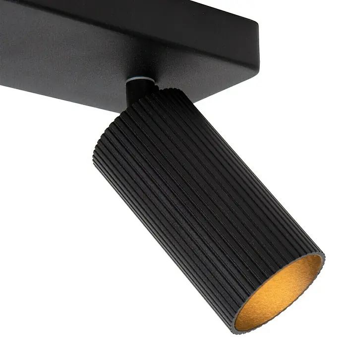 Lucide Clubs Deckenstrahler - 40 W, L x B x H: 35,5 x 12 x 11,5 cm, Schwarz, GU10, Anzahl Leuchtmittel: 2 Stk. - Nahaufnahme einer schwarzen LED-Deckenleuchte mit geriffeltem Lampenkopf und goldener Innenseite, die eine elegante und moderne Beleuchtungslösung darstellt.