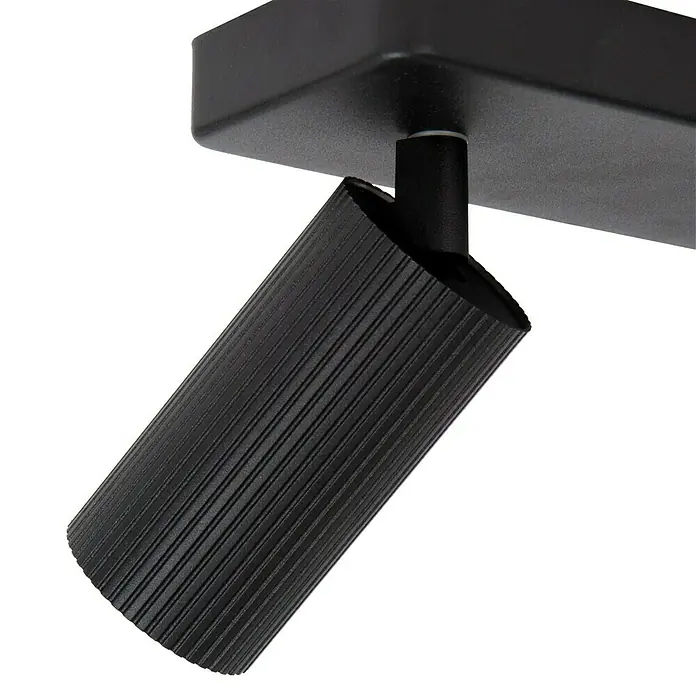 Lucide Clubs Deckenstrahler - 40 W, L x B x H: 35,5 x 12 x 11,5 cm, Schwarz, GU10, Anzahl Leuchtmittel: 2 Stk. - Nahaufnahme einer schwarzen, zylindrischen Deckenleuchte mit geriffeltem Lampenkopf, ideal für moderne Innenräume, die eine stilvolle Beleuchtungslösung suchen.
