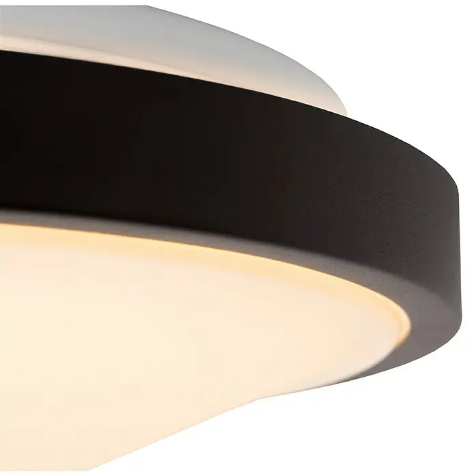 Lucide LED-Deckenleuchte rund Dasher - 12 W, Ø x H: 31,5 x 9 cm, Schwarz, Warmweiß - Nahaufnahme einer modernen Deckenleuchte mit schwarzem Rand und warmer Beleuchtung. Elegantes Design für stilvolle Innenräume.