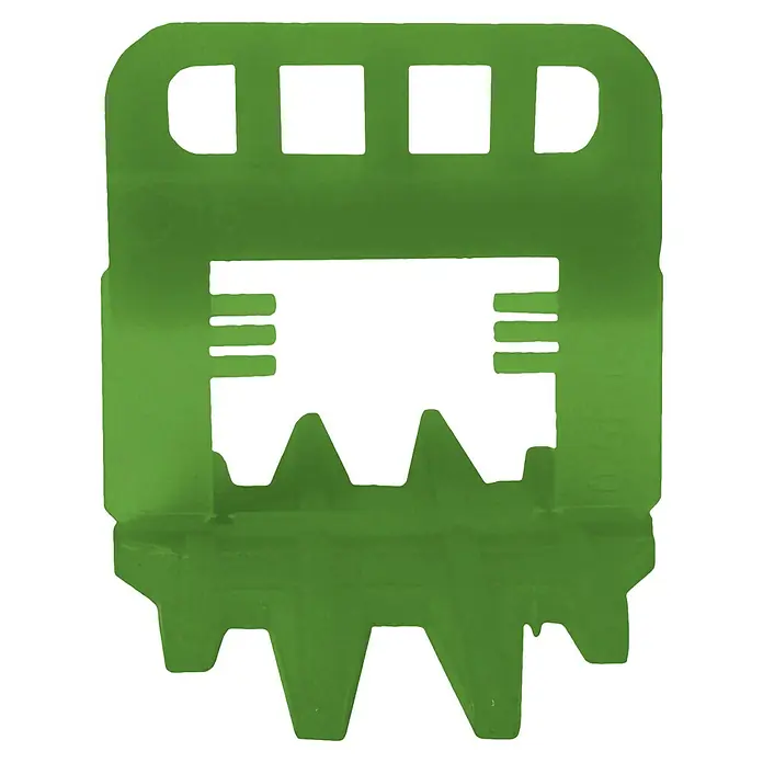 Tayg Sistema de nivelación - 3 mm, 250 ud. - Primer plano de una pieza moldeada por inyección de plástico verde con aberturas rectangulares y dientes irregulares, un elemento de construcción versátil.