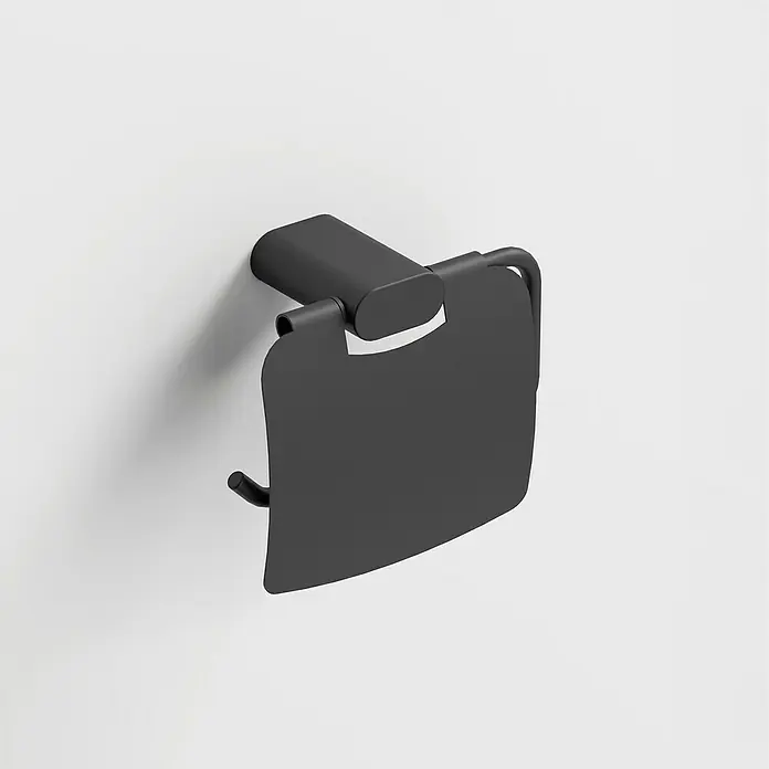 Camargue Mont Valier Portarrollos - Con tapa, Negro - Primer plano de un moderno portarrollos de papel higiénico negro con tapa montado en una pared blanca. El diseño es elegante y minimalista.