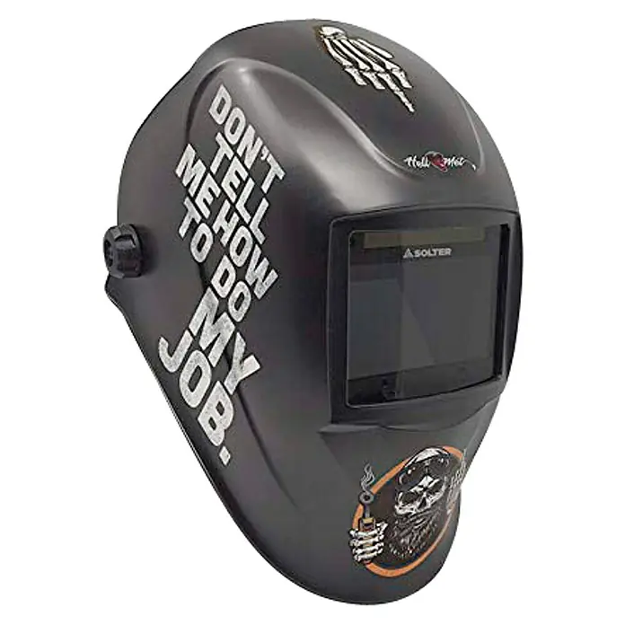 Solter Casco de soldadura Hellmet Job - Sensibilidad ajustable - Un casco de soldadura negro con estampados, incluyendo un esqueleto y la frase "Don't tell me how to do my job".