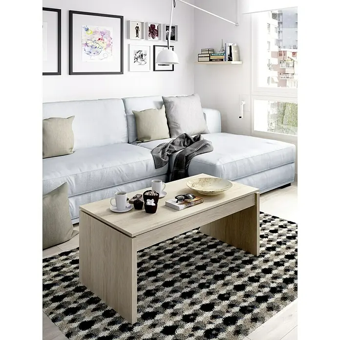 Dekit Mesa auxiliar de jardín Side - L x An x Al: 50 x 100 x 43 cm, Natural - Un salón luminoso con un sofá cómodo y una mesa de centro moderna colocada sobre una alfombra estampada.