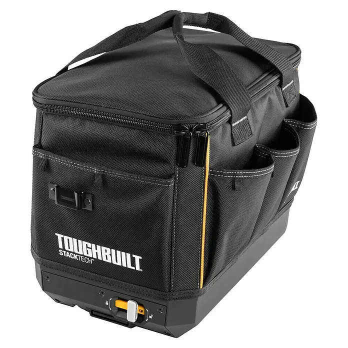 ToughBuilt StackTech Bolsa para herramientas - L x An x Al: 440 x 310 x 340 mm, Poliéster - Esta imagen muestra una bolsa de herramientas negra ToughBuilt Stacktech con asa y múltiples compartimentos, sobre una base gris.