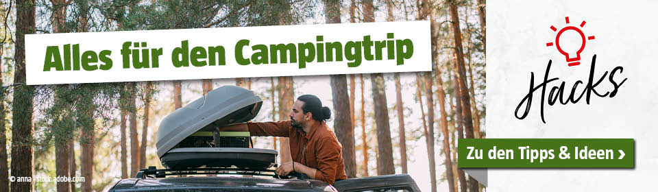 Mann verstaut Gepäck in der Dachbox vom Auto mit Titel Alles für den Campingtrip