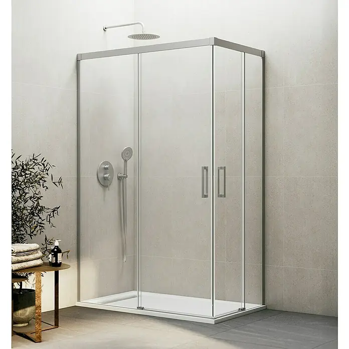 GME Mampara de ducha esquinera Basic Angular - L x An x Al: 70 cm x 70 mm x 196 cm, Vidrio transparente, Nickel - La imagen muestra una moderna mampara de ducha con paredes de vidrio y marcos plateados, situada en un baño elegante.
